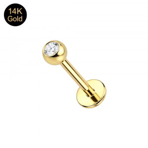 Close-up view of a 3mm stone set in a 14K solid gold ball top, mounted on a 16G labret post for professional ear curations.