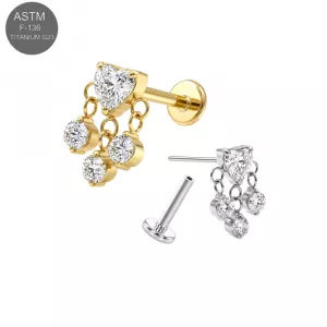 ASTM F-136 implant grade titanium threadless flat back labret ear piercing studs displaying a prong-set clear heart CZ head with a suspended triple bezel-set round crystal cable chain dangle loop, in plain silver and gold PVD versions.